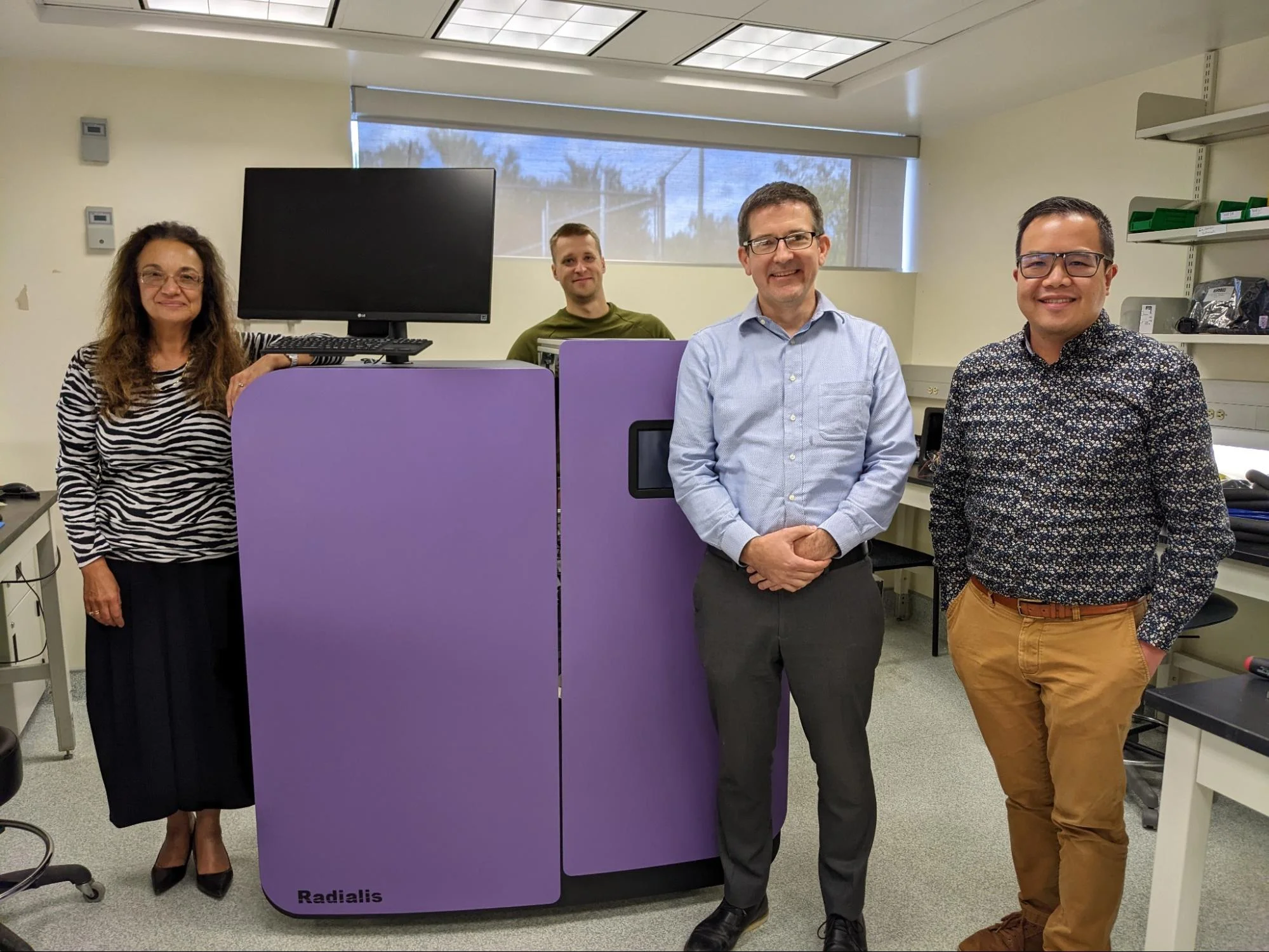 Radialis Team with Leo from INOVAIT smile and pose with the Radialis PET Imager