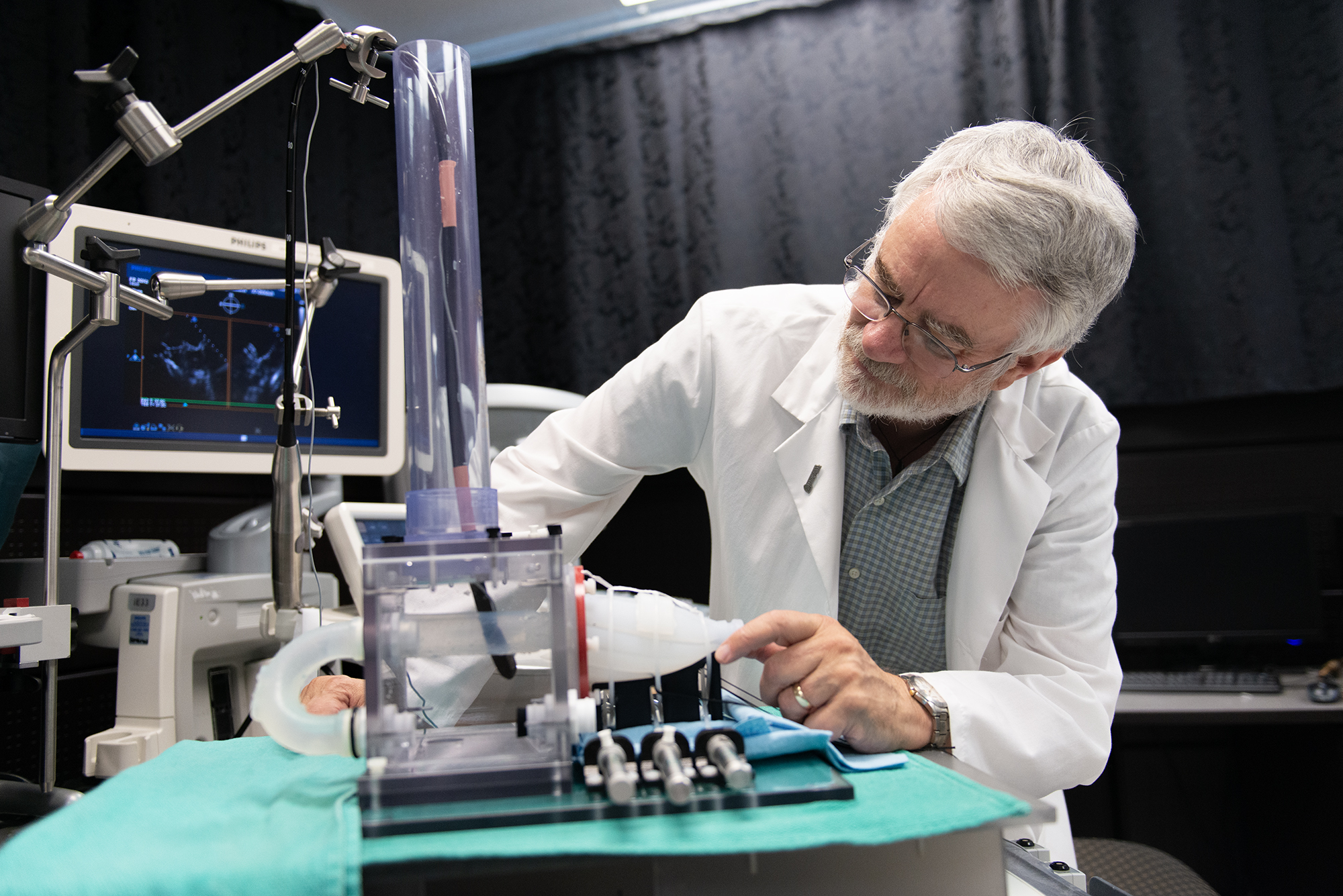 Terry Peters tinkers with one of his cardiac care devices.